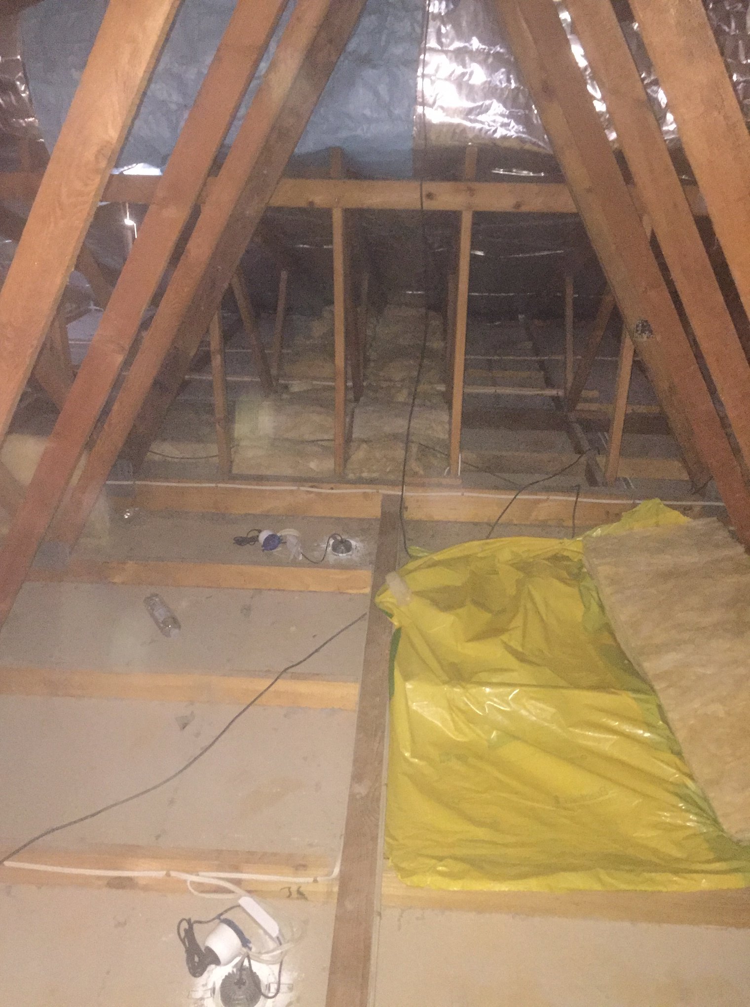 : An area filled with discarded materials, indicating a cleanup or renovation effort.