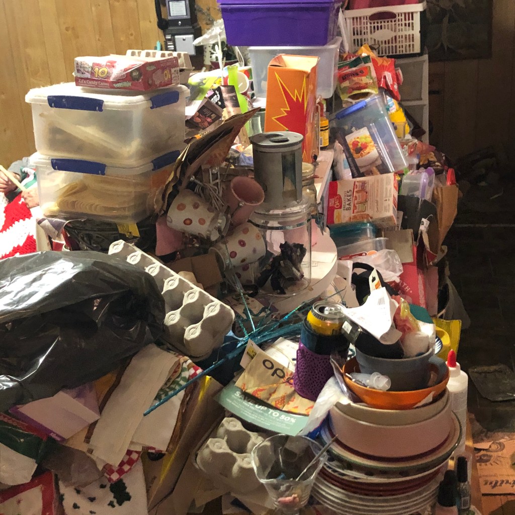 shelves filled with kitchenware, tools, and miscellaneous items.