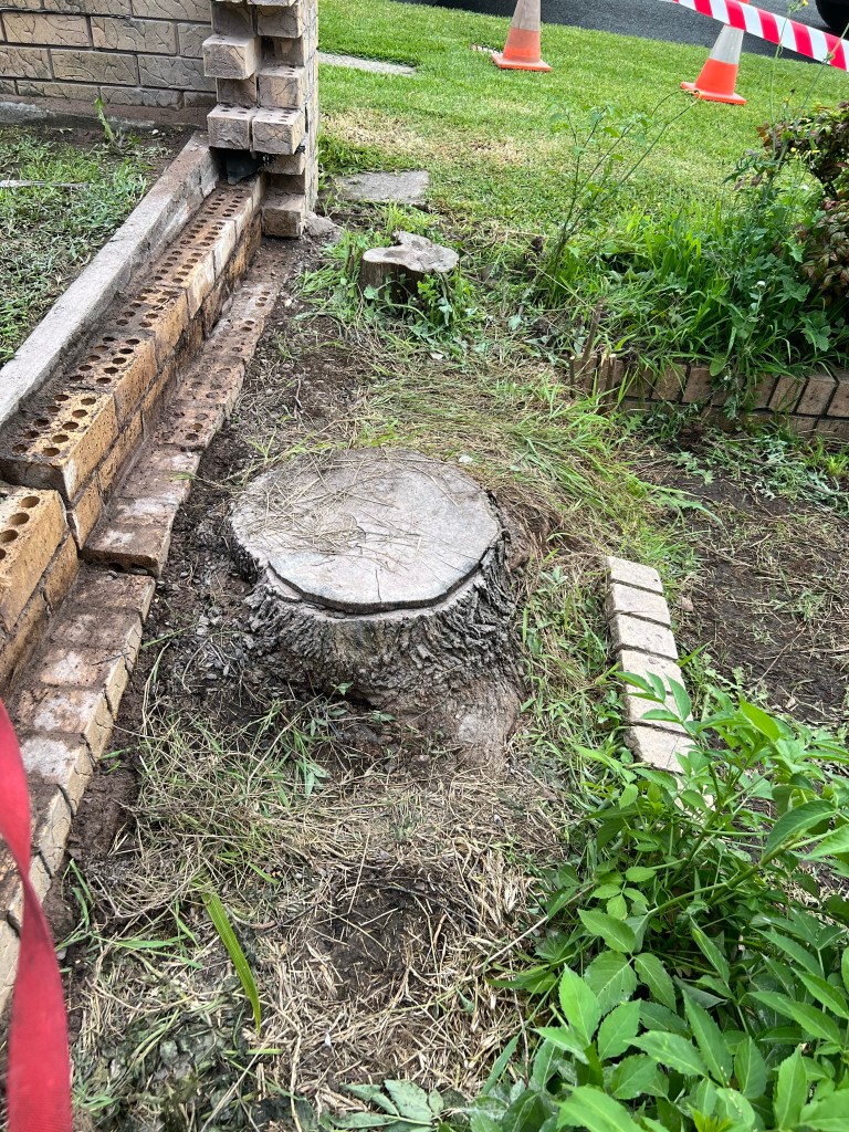 Laying fence brick work outside on a home boundary wall. Apart of our home improvement services.